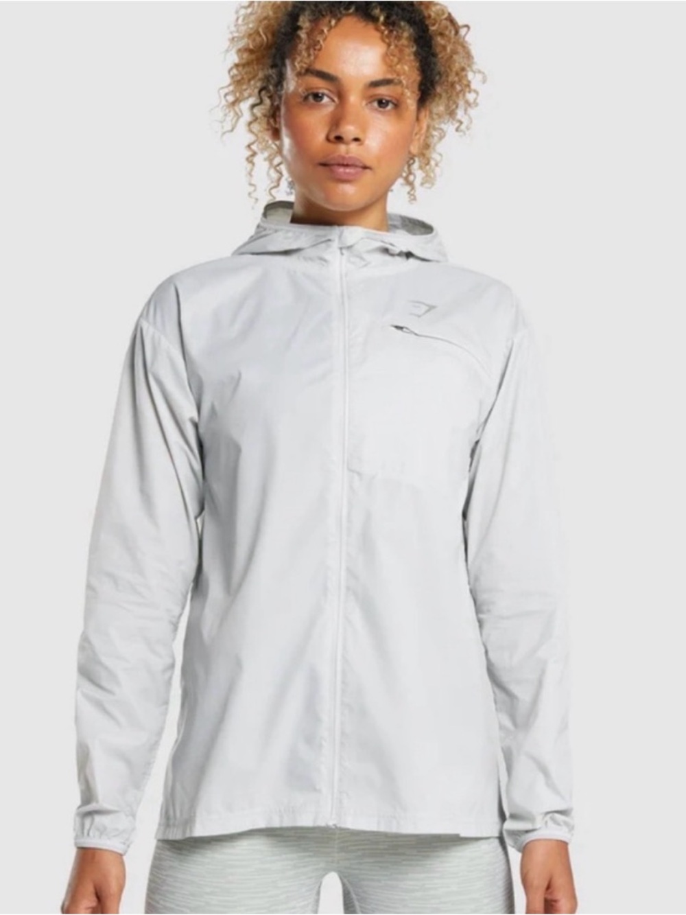 Gymshark Women’s Light Gray Hooded Windbreak Jacket.